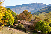 Autumnal countryside landscape view of mountains, Nuestra Señora de Tres Fuentes church, Valgañón, La Rioja, Spain