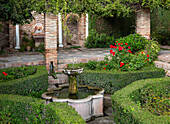 Water fountain in garden of historic Moorish  palace Alcazaba, Malaga, Andalusia, Spain