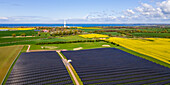  View of a PV area with the Baltic Sea in the background, Ostholstein, Schleswig-Holstein, Germany 