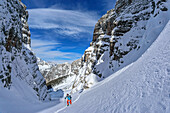  Woman on ski tour ascending the Forcella Toanella, Bosconero Group, Dolomites, UNESCO World Heritage Dolomites, Veneto, Italy 