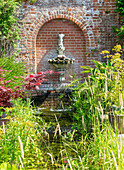 Water fountain, Walled kitchen garden Redisham Hall gardens and plant nursery, Redisham, Suffolk, England, UK
