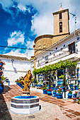  Iznajar a white village full of flowers, on the reservoir, in the olive belt of the province of Cordoba, Spain 