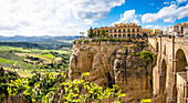  Ronda, view of the new town with hotel, and the 165 meter high bridge Puente Nuevo, which connects the old and new town, Malaga province, Spain 