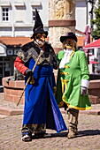  Man in the costume of the “great magician” and woman in the costume of “Puss in Boots”, characters from the Brothers Grimm fairy tale “Puss in Boots”, Steinau an der Straße, Spessart-Mainland, Hesse, Germany 