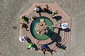  Aerial view of the fairy tale characters of the Brothers Grimm standing around the fairy tale fountain in the old town, Steinau an der Straße, Spessart-Mainland, Hesse, Germany 