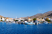  Island capital Póthia with customs and port office, nautical museum, town hall (Dimarchio) and boats in the harbor on the island of Kalymnos (Kalimnos) in Greece 