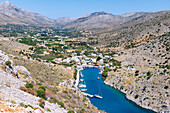  Gulf of Vathí with harbor bay and view into the green valley of Vathí with citrus plantations on the island of Kalymnos (Kalimnos) in Greece 