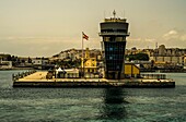  Port of Ceuta with port tower and Spanish flag, in the background the city center, Ceuta, North African coast, Spain 