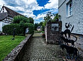  Front garden with fairy tale motifs, Brothers Grimm House, Amtshaus, Steinau ad Straße, Hesse, Germany 