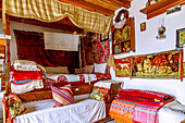  Traditional House of Antimachia on the island of Kos in Greece: Living room with parents&#39; bed and baby cradle hanging above it 