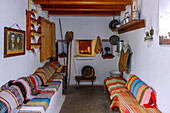  Traditional House of Antimachia on the island of Kos in Greece: Living room with oven and seating 