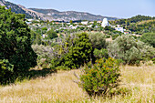  Mountain village Lagoudi with church Panagia Theotokou Genesiou (Kimissis tis Theotokou) and mountain range of Oros Dikeos on the island of Kos in Greece 