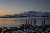  inter in the Trömso region, Kvaloysletta, with mountains in the twilight 