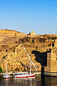  View of the Nile, here the Nile section near Aswan, Egypt, with typical boats and landscape 