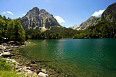  The Estany de Sant Maurici lake and the Els Encantats mountain range in the Aigüestortes i Estany de Sant Maurici National Park, Catalonia, Spain, Europe 