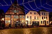  Town houses and Museum Buxtehude at St. Petri Square at night, Buxtehude, Lower Saxony, Germany 