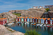  Colorful boathouses in Smoegen, archipelago, Bohuslaen, Sweden 