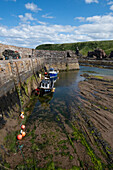  View of an old harbour at low tide, East Lothian, Scotland, United Kingdom 