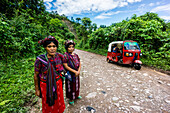 Women in indigenous costume and Queqchi headdress, on the road from La Taña to Union 31 May, Reyna area, Uspantan department, Guatemala, Central America