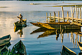 Canoes stranded on Lake Atitlan in front of the San Pedro volcano, Santiago Atitlan, Sololá department, Guatemala, Central America