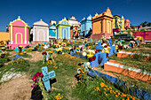 Freshly painted colorful graves, Day of the Dead celebration at the General Cemetery, Santo Tomas Chichicastenango, Republic of Guatemala, Central America