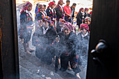 Religious brothers in the Church of Santo Tomás, Chichicastenango, Quiché, Guatemala, Central America