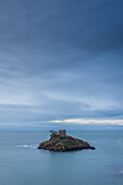  Tower on the small island of Ile au Guerdain. Blue cloudy sky, calm sea. 