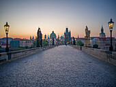  On the Charles Bridge at sunrise, Old Town Bridge Tower, Charles Bridge, Vltava River, Old Town of Prague, Prague, Czech Republic, Europe 