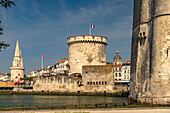  Harbor entrance to the old harbor Vieux Port with the medieval towers Tour St.-Nicolas, Tour de la Lanterne and Tour de la Chaine, La Rochelle, France, Europe 