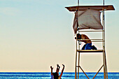  Photographer on the beach in Gozo, Malta 