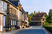  Main street with half-timbered houses in Beuvron-en-Auge in the Pays d&#39;Auge in the Calvados department in the Normandy region of France 