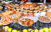  Seafood of all kinds on display at the fish market (Poissonerie) in Trouville-sur-Mer (Trouville) on the Flower Coast (Côte Fleurie, Cote Fleurie) in the Calvados department in the Normandy region of France 