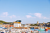  Harbour Port de Plaisance and Fishing Museum Musée des Pêcheries (Musee des Pecheries) with view of the church Eglise St-Etienne (Église Saint-Étienne) and Abbatiale de la Sainte-Trinité in Fécamp (Fecamp) on the Alabaster Coast, (Côte d&#39;Albatre, Cote d&#39;Albatre) in Normandy in France 