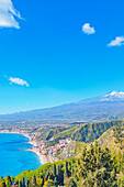 View of the Ionian coast and mount Etna in the distance, Taormina, Sicily, Italy