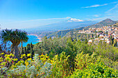 View of the Ionian coast and mount Etna in the distance, Taormina, Sicily, Italy