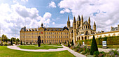  Abbaye aux Hommes (Men&#39;s Abbey, Hôtel de Ville, Town Hall) and Church of Saint-Ètienne (Saint-Etienne) with garden and sculpture &quot;Lou&quot; by Jaume Plensa (2015) in Caen in the Calvados department in the Normandy region of France 