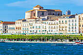  Green waterfront promenade with interesting buildings in Syracuse, Sicily, Italy  