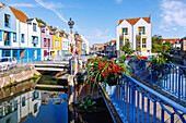  Flower-decorated canals and colorful houses on Rue Motte in the Saint-Leu district of Amiens in the Somme department in the Hauts-de-France region of France 