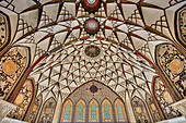 Richly decorated domed ceiling in one of the halls of the Tabatabaei House, a historic mansion built around 1880 in Kashan, Iran.