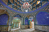 Interior view of Imamzadeh Mohammed Helal Shrine elaborately decorated with Islamic calligraphy and mirror mosaics (aina-kari). Aran o Bidgol, Iran.