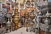 A selection of Qalamzani, or Ghalamzani (traditional Iranian metal engraving art) items displayed in a gift shop in the Grand Bazaar. Isfahan, Iran.