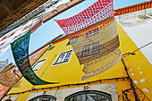 Old town street decorated with Portuguese artefacts, Coimbra, Coimbra district, Centro Region, Portugal