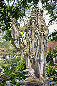 Statue of Rangda, the demon queen, in the  Tirta Gangga water palace. Karangasem regency, Bali, Indonesia.