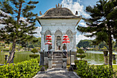 Entrance to the walking bridge leading to the Gili Bale, main building of the Ujung Water Palace (Taman Ujung). Karangasem Regency, Bali, Indonesia.