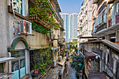 Residential buildings with fenced windows and balconies  in the historic centre of Macau city, China.