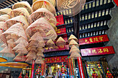 Large incense spirals hang from the ceiling in the Buddhist Pavilion Zhengjiao Chanlin at the A-Ma Temple. Macau, China.