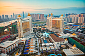 Aerial view of the Galaxy Macau Hotel, a luxurious resort complex, at dusk. Cotai, Macau, China.