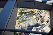 Aerial view of the circular road junction and construction site from Macau Tower observation deck. Macau, China.