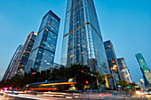 High-rise buildings in Futian Central Business District (CBD) illuminated at dusk. Shenzhen, Guangdong Province, China.