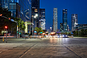 High-rise buildings in Futian Central Business District (CBD) illuminated at dusk. Shenzhen, Guangdong Province, China.